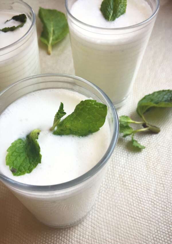 glasses of mint lassi with mint garnish