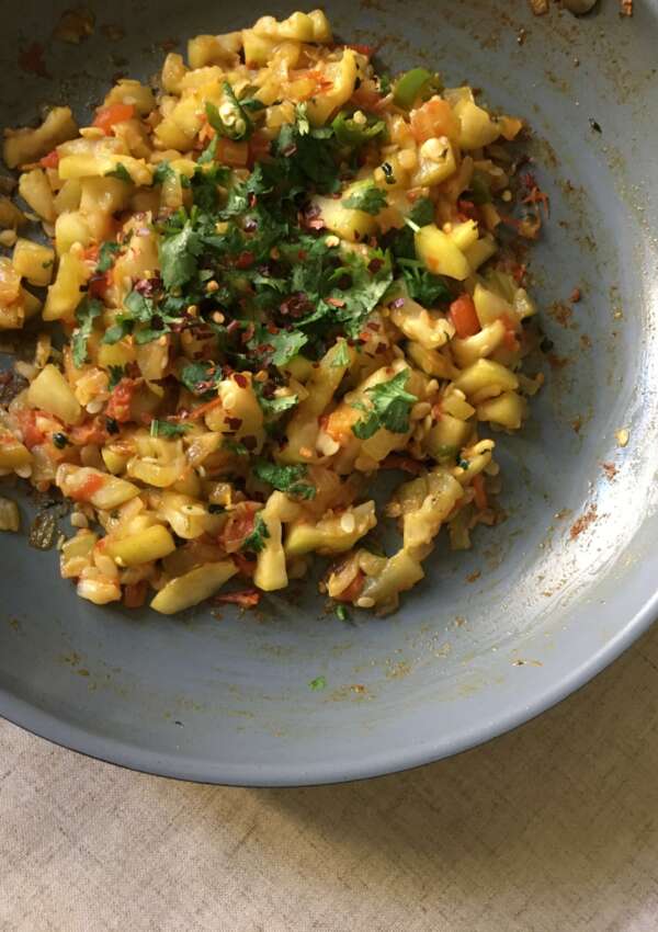 lauki ki sabzi in a pan garnished with cilantro