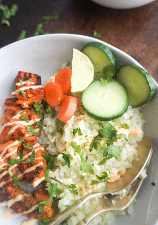 Salmon and cauliflower rice bowl with vegetables