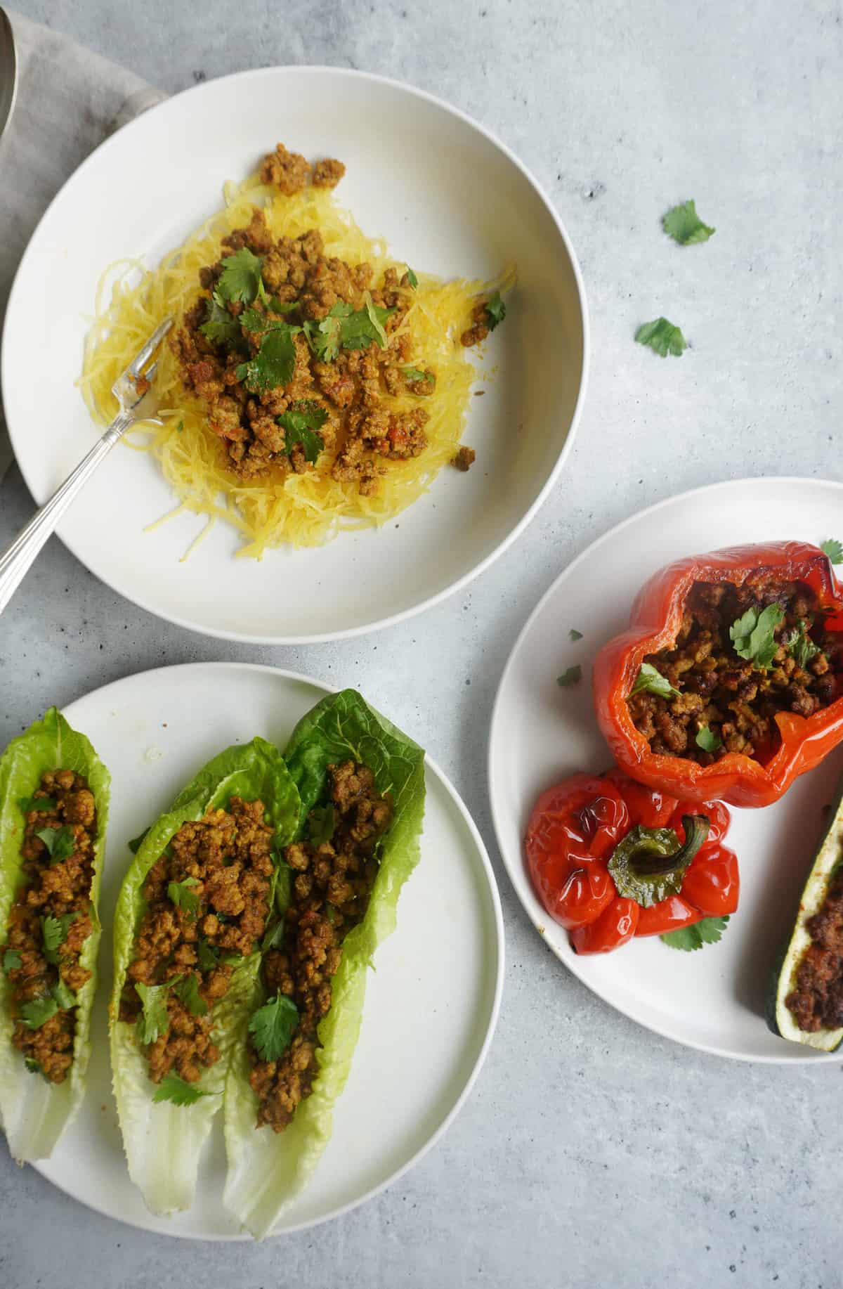 3 plates with Keema served with spaghetti squash, bell pepper, lettuce cups