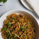 keema garnished with ginger and cilantro