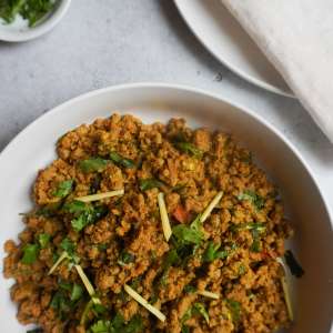 keema garnished with ginger and cilantro