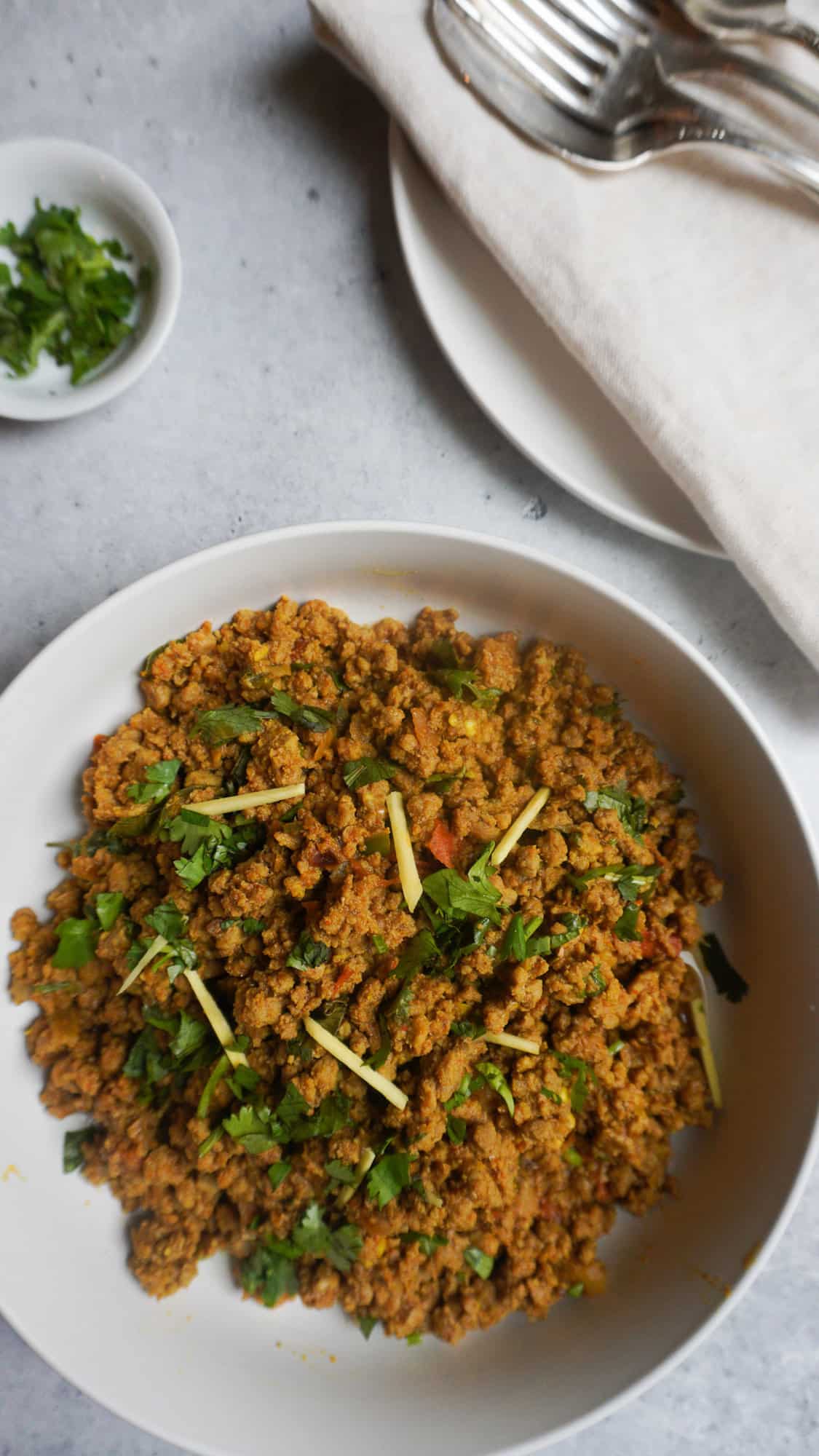 keema garnished with ginger and cilantro