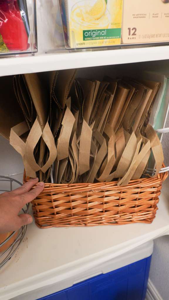 basket with brown paper bags