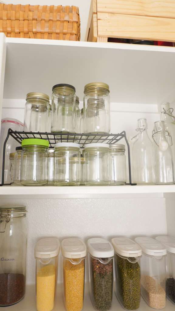 pantry shelves with glass bottles