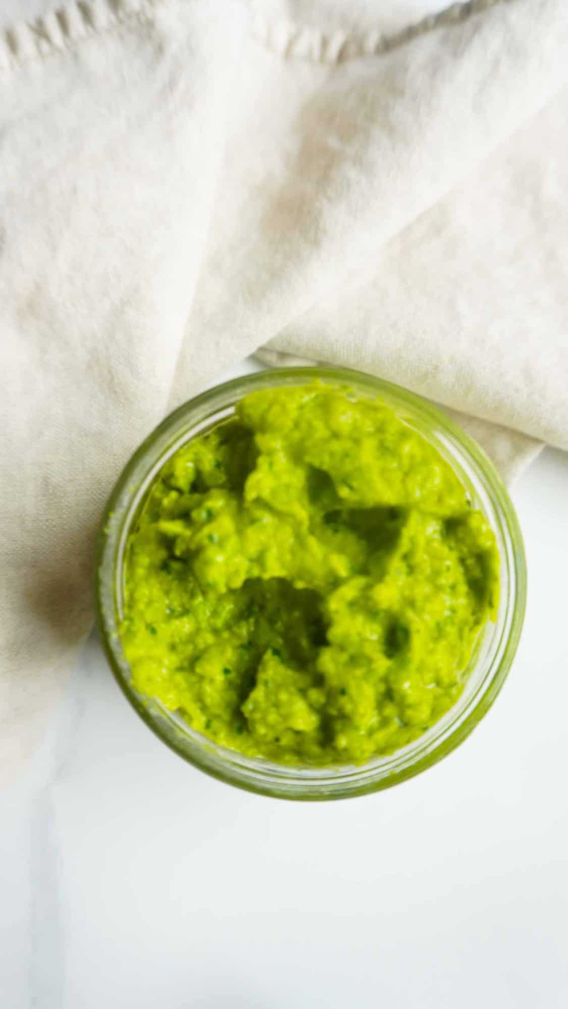 Ariel view of Sweet pea chutney in an open jar 