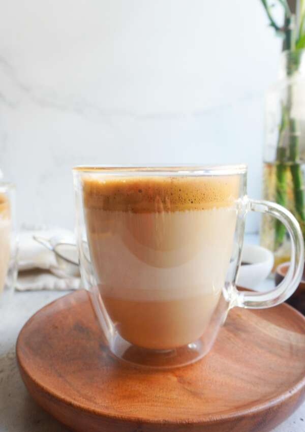 A clear mug with Pakistani phitti hui coffee