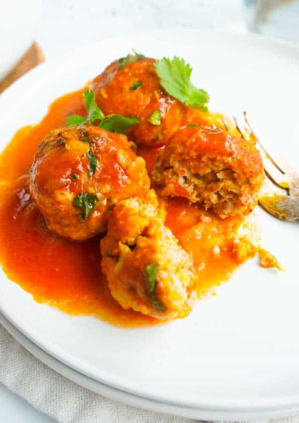 Chicken Kofta Curry on a plate with a fork.