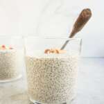 chia kheer in glass cup with a silver spoon