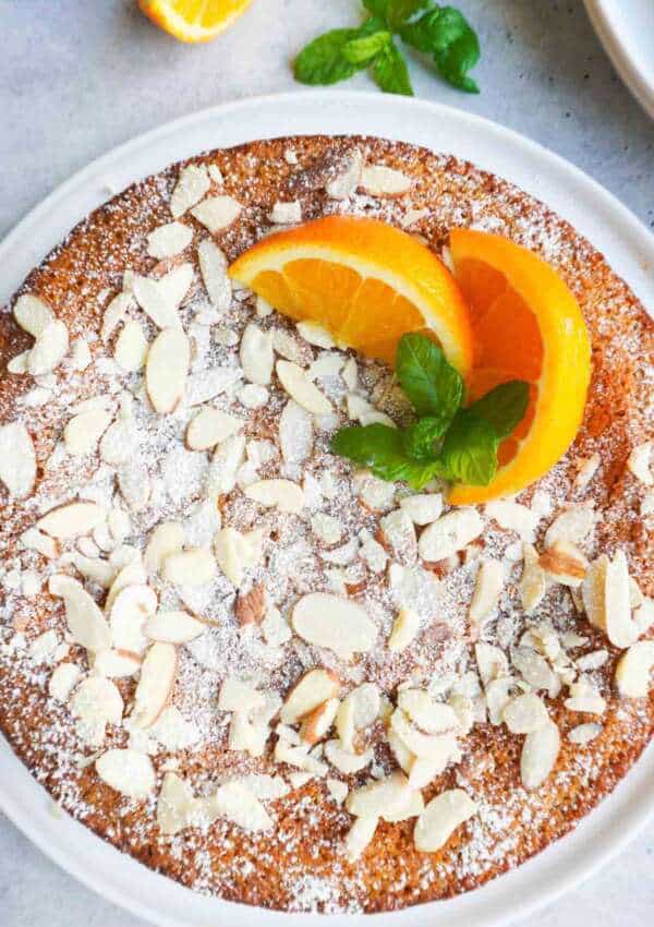 a top view of decorated orange blossom almond cake