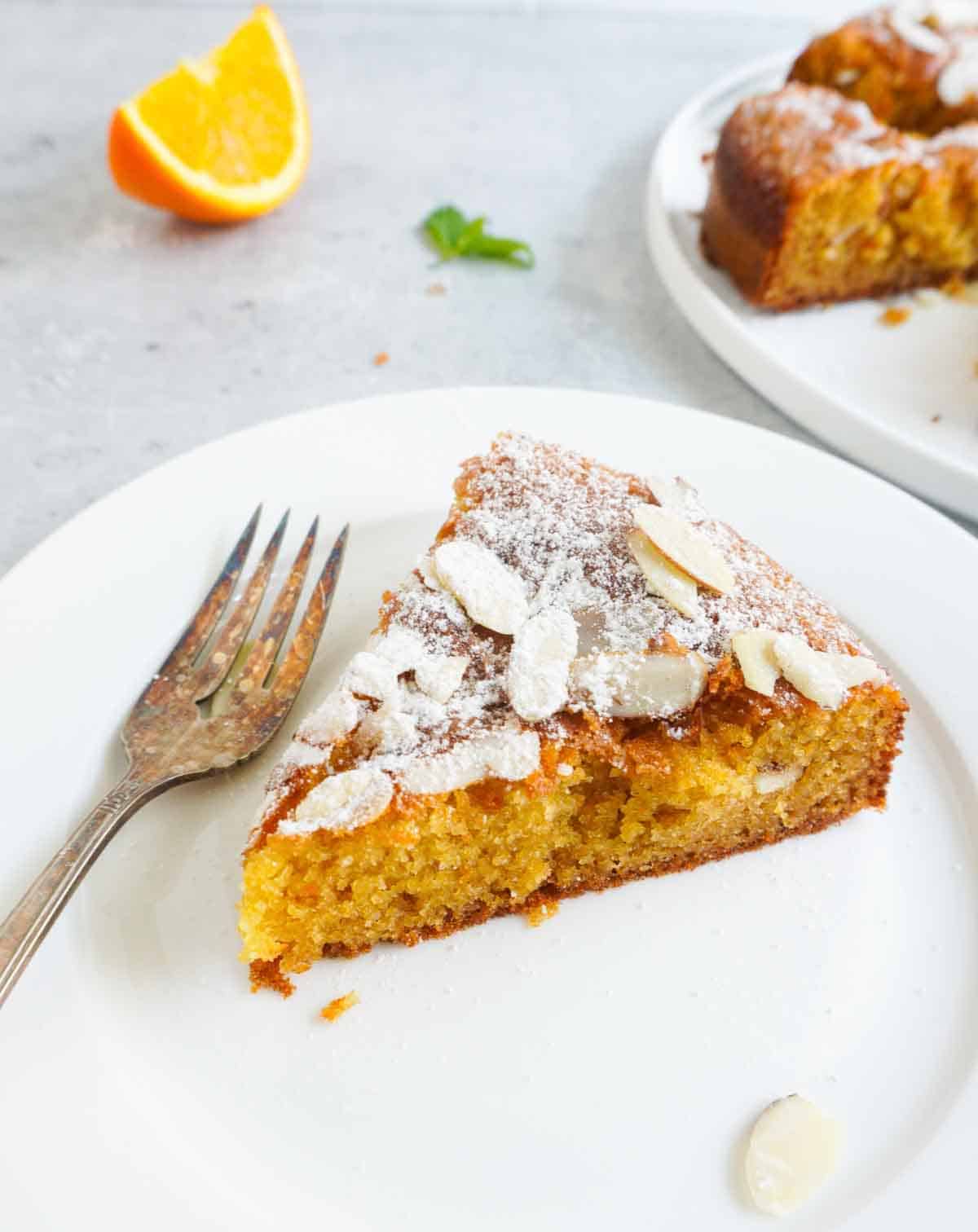 a slice of orange blossom cake with fork