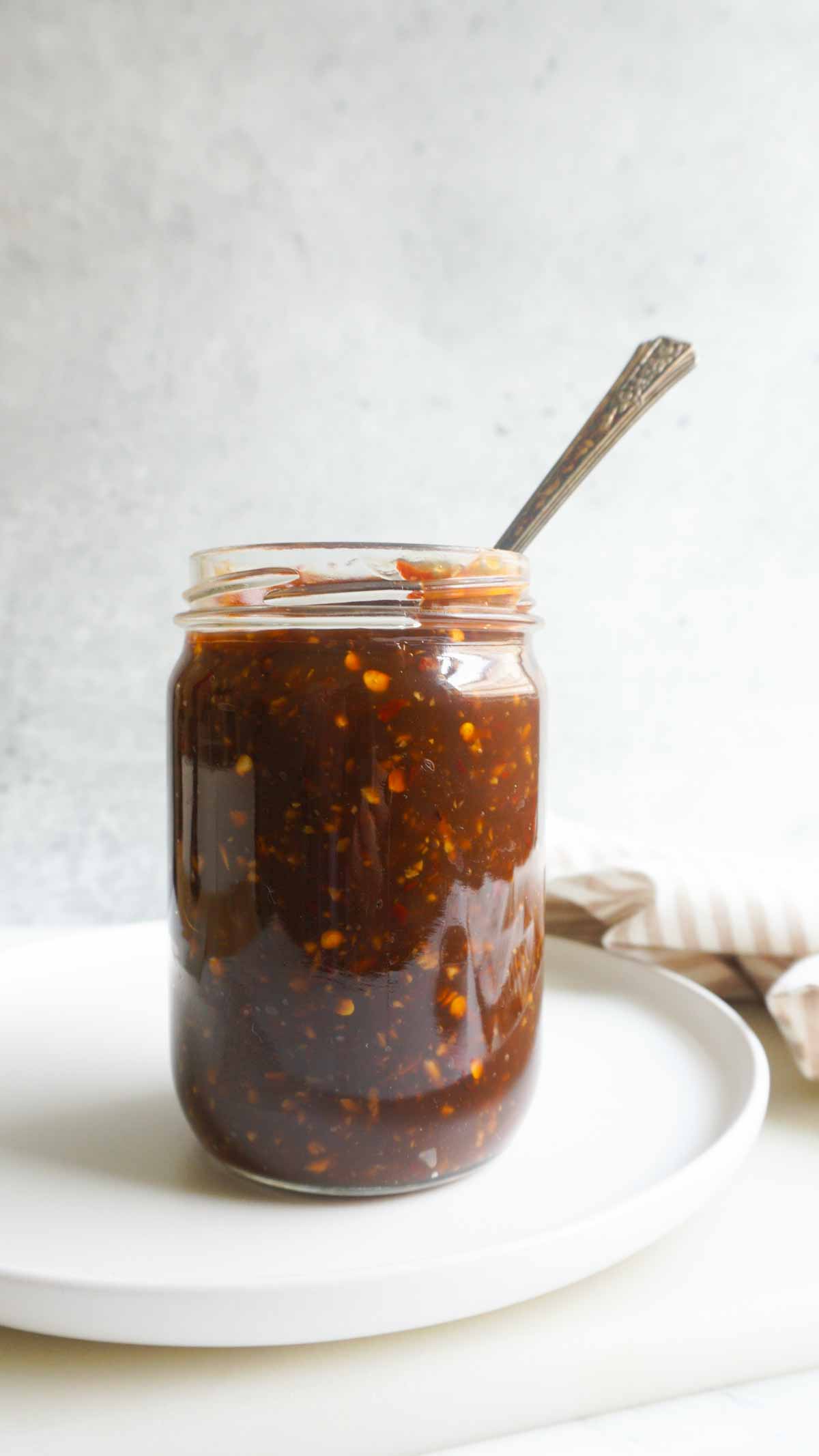 batch prepped gluten free teriyaki sauce in jar with spoon