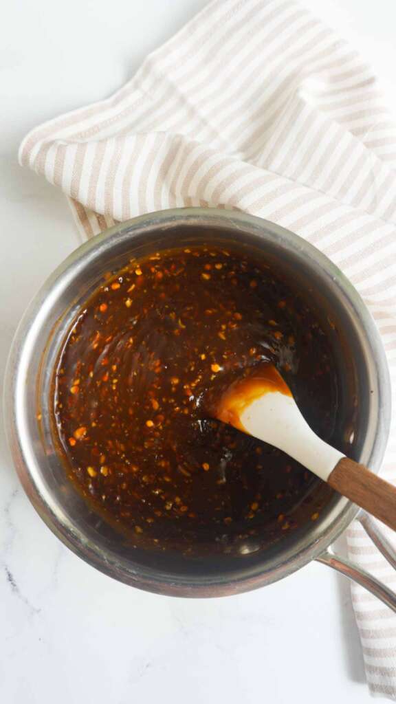 homemade gluten free teriyaki sauce in sauce pan with spatula