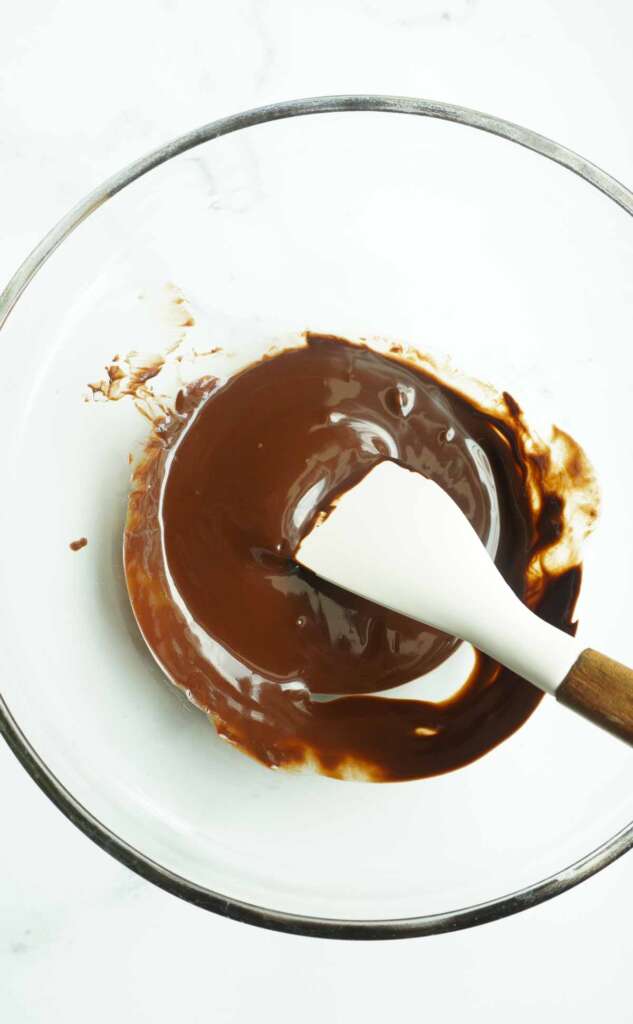 melted chocolate in a bowl with a spatula