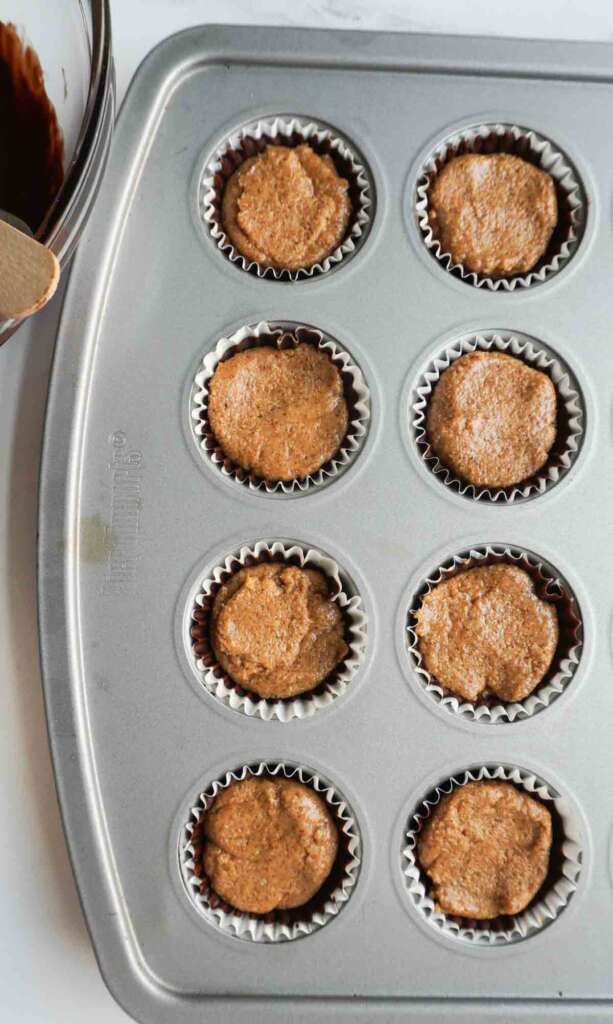 peanut butter filling in chocolate lined muffin pan
