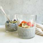 2 jars of chia seed pudding with strawberries and blueberries