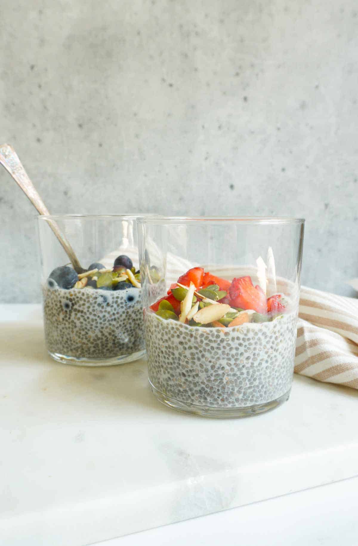 2 cups of chia pudding with berries, nuts and seeds