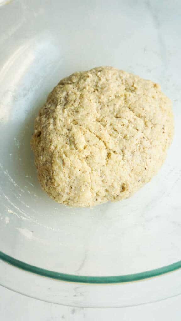 pre baked gluten-free ball of dough in a glass bowl