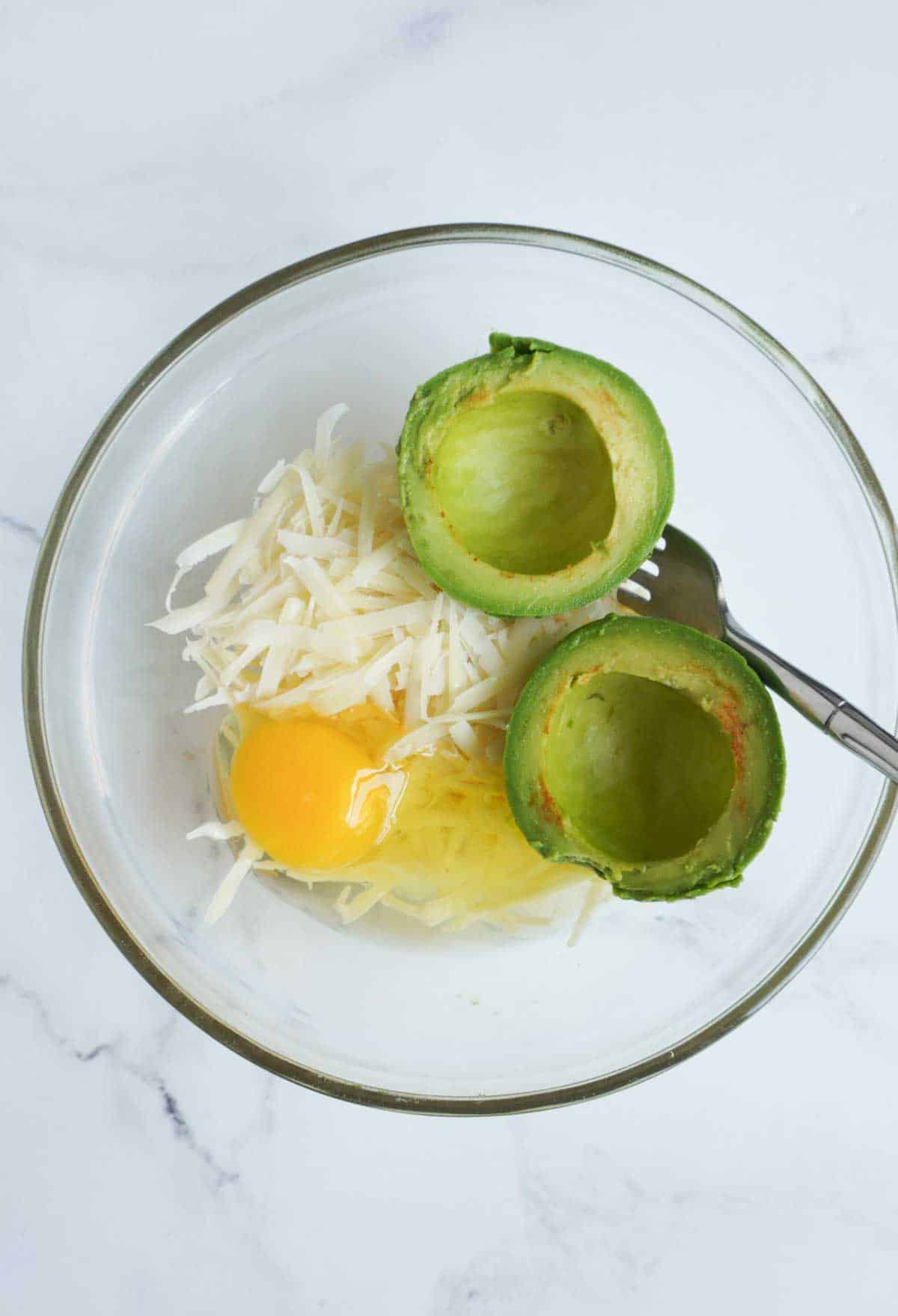 Ingredients for avocado bread in a bowl with a fork