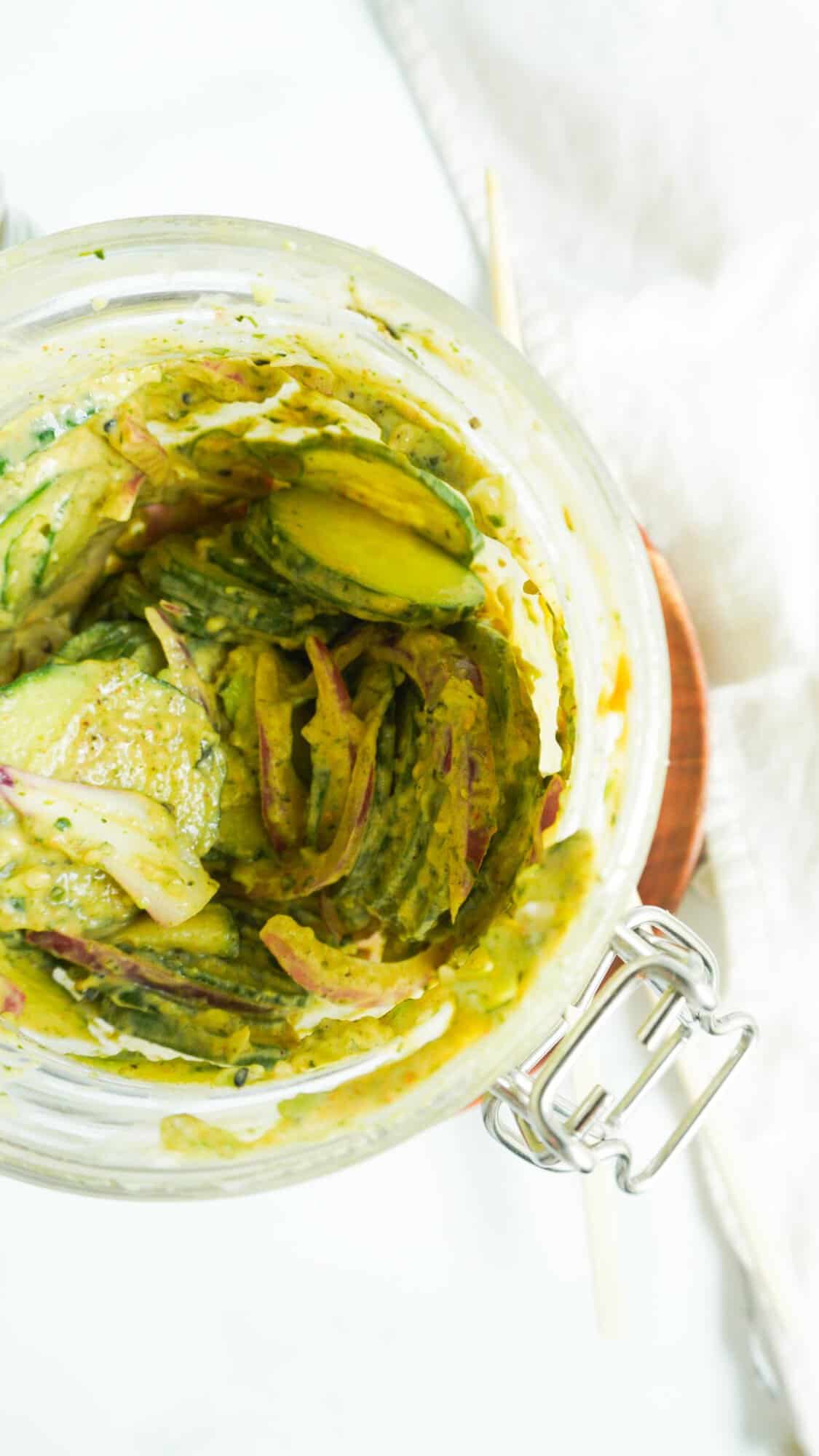 View inside a jar of cucumber salad