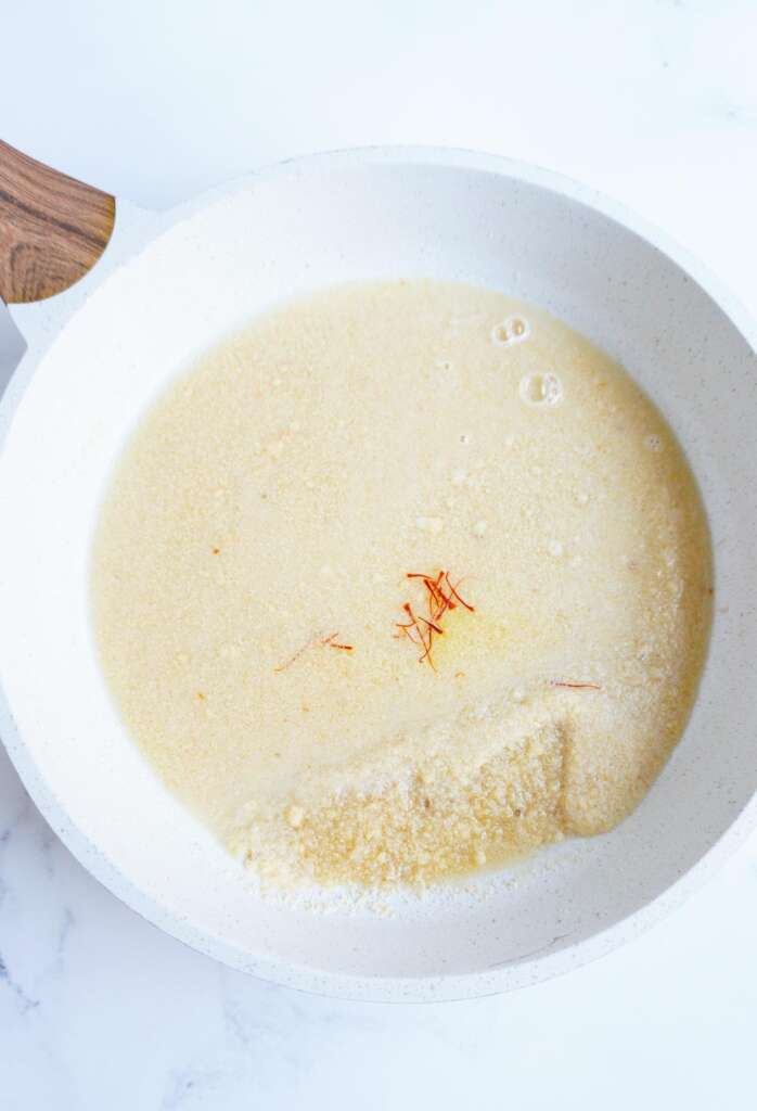 almond flour, water and saffron in pan