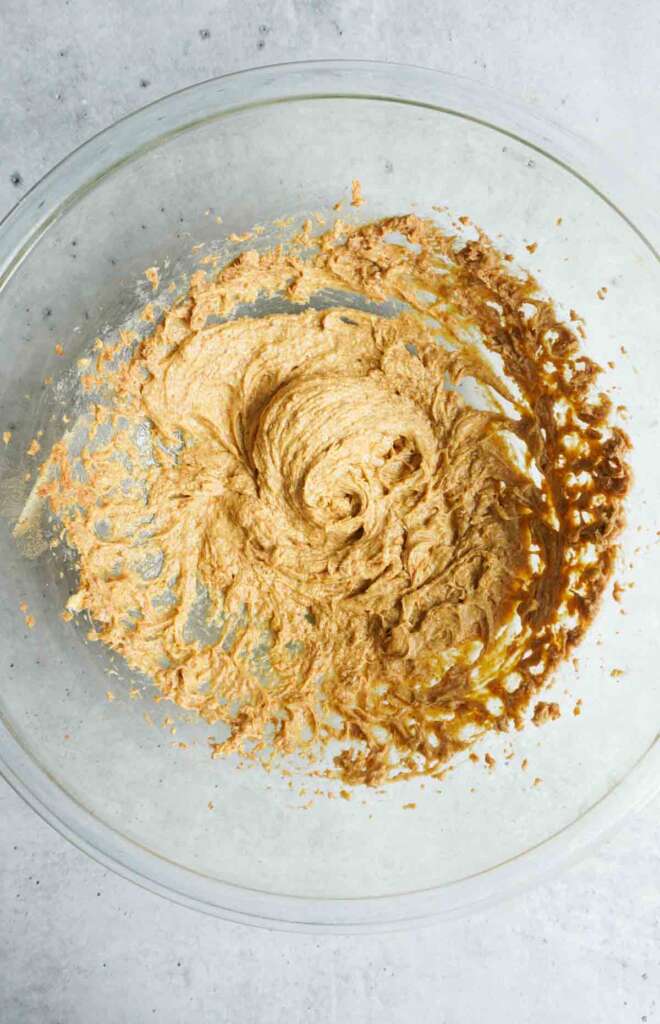 A bowl with creamed butter and coconut sugar.